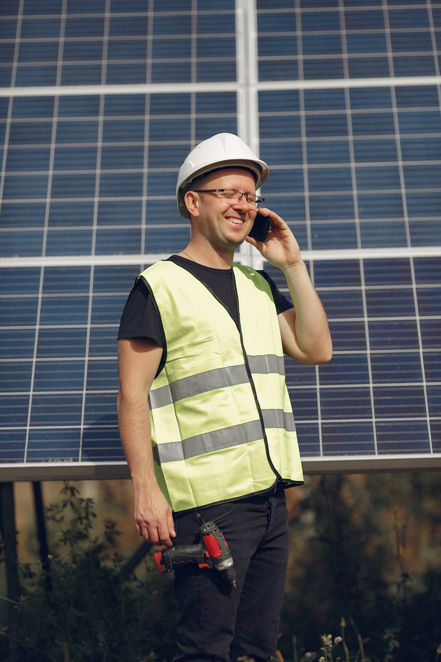 man-with-white-helmet-near-solar-panel-scaled.jpg